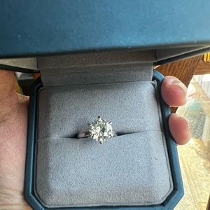 8mm round brilliant cut moissanite in size 6 silver setting